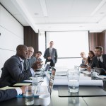 Board of directors meeting in conference room.