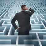 Concept of project management challenges. Confused businessman in a maze