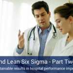 Two healthcare professionals discussing lean six sigma's role in the healthcare industry.