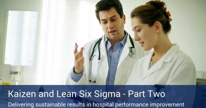 Two healthcare professionals discussing lean six sigma's role in the healthcare industry.