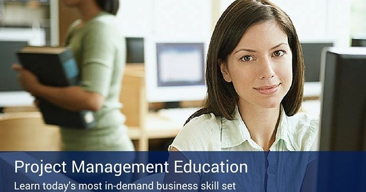 A woman working in a computer lab to become a project management professional.