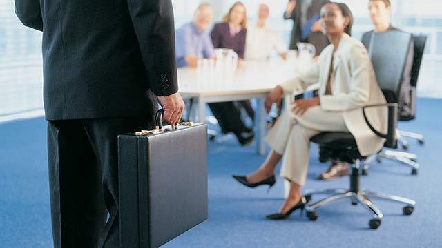 A businessman holding a briefcase.