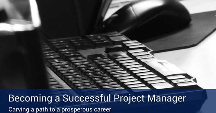 A poster that says "becoming a successful project manager" with a black keyboard in the background.