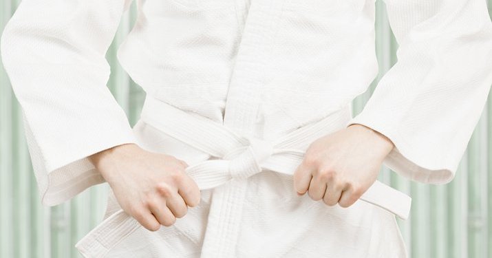 A white karate uniform and a white karate belt.