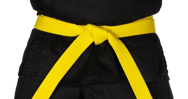 A black karate uniform with a yellow belt.