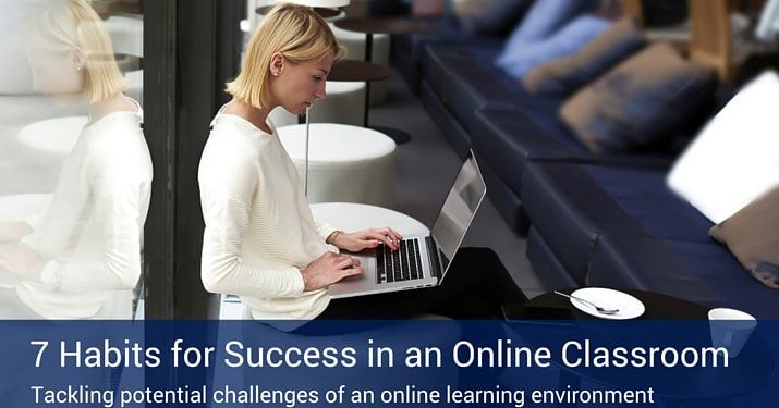 A woman working on her online classes on her laptop in a co-working space with black leather couches.