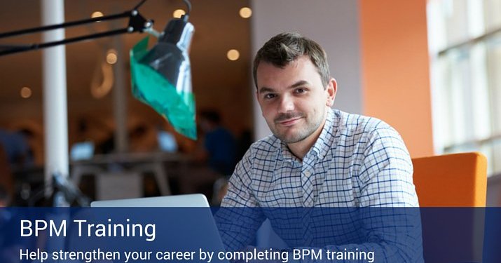 A man working at his desk on a computer next to a large desk lamp. There is a banner that reads "BPM Training" across the bottom of the image.