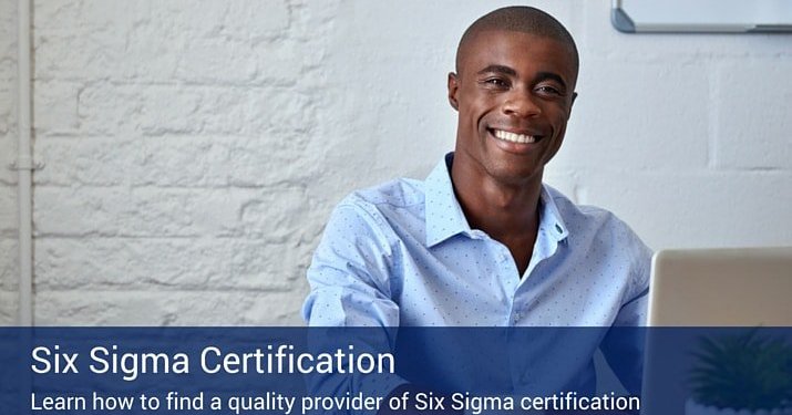 A man on his laptop looking into the camera, while earning his six sigma certification..