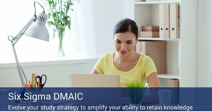 A woman sitting at a desk with a lamp and a cup of pencils working on her laptop, learning about DMAIC.