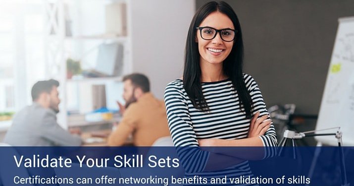 A woman with her arms crossed with two other employees in the background sitting at a table. There is a banner that says "validate your skill sets" at the bottom of the image.