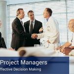 A group of business and medical professionals greeting each other at a meeting. There is a banner at the bottom of the image that says "Decisive Project Managers".
