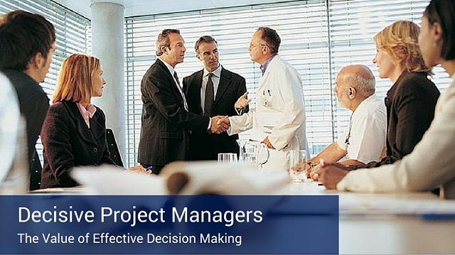 A group of business and medical professionals greeting each other at a meeting. There is a banner at the bottom of the image that says "Decisive Project Managers".