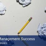 Crumpled up pieces of paper and a broken yellow wooden pencil and a blue banner across the image that reads "project management success - five secrets behind it".