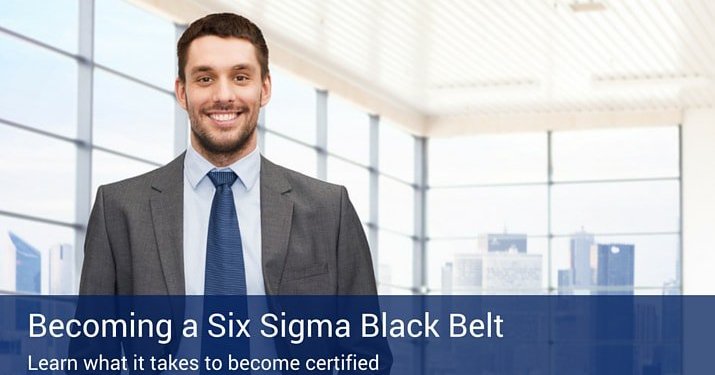 A man in a suit and tie smiling into the camera with a blue banner that says "Becoming a six sigma black belt" on the bottom of the photo.