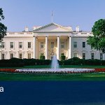 A picture of the White House that has a banner below that says " Six Sigma - Government".