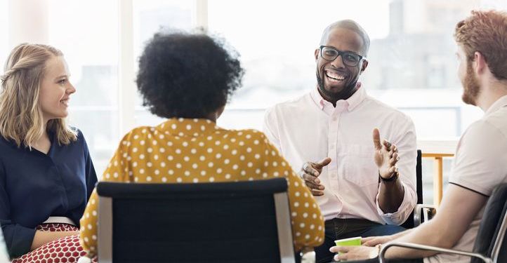 Smiling business people having a meeting in an office.