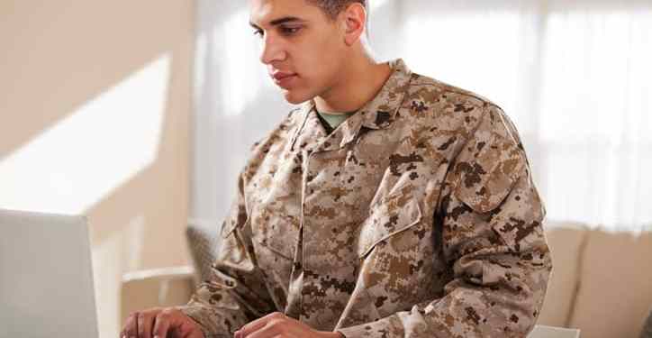 US Marine Corps Solider Working on Laptop